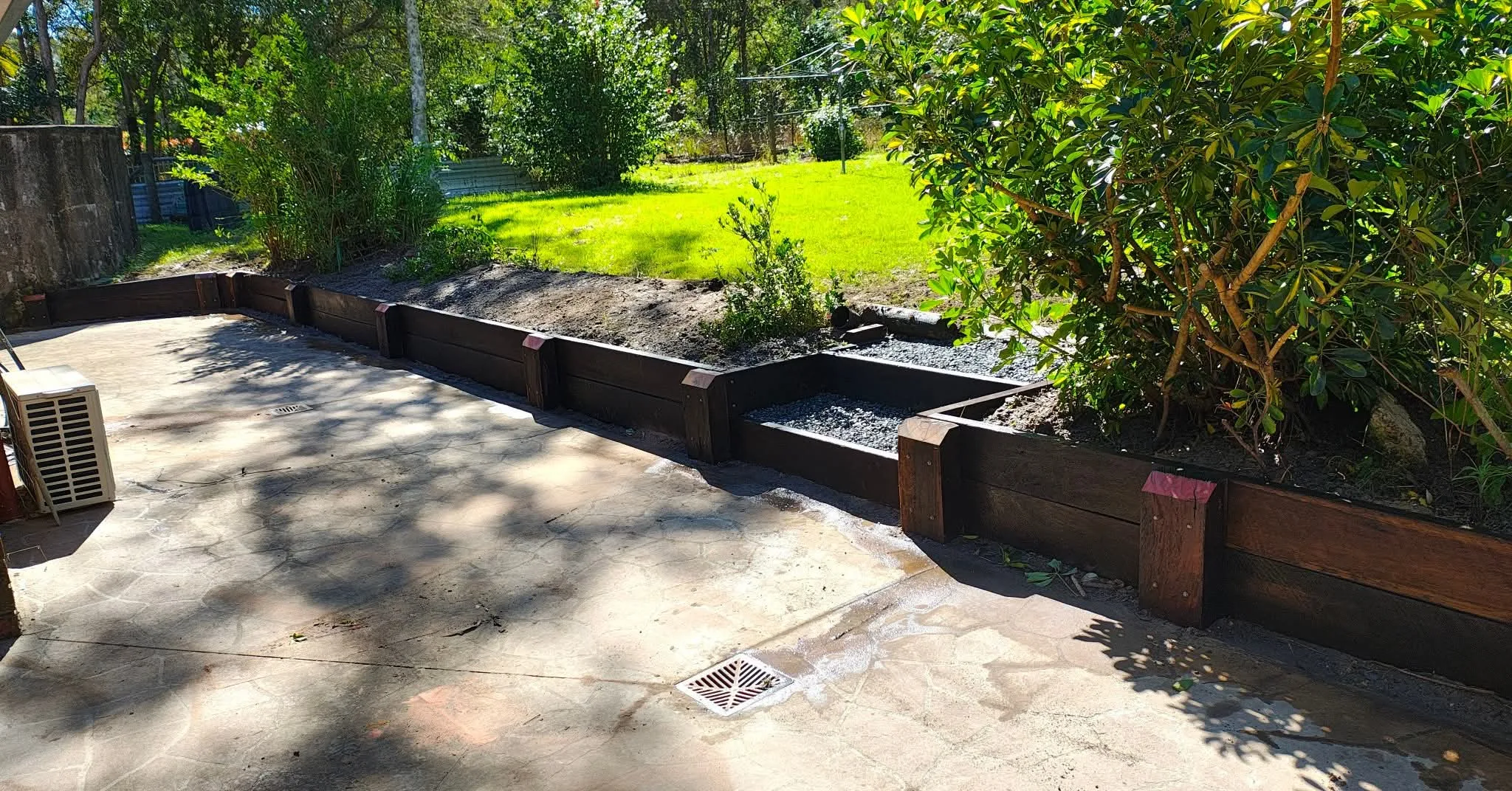Finished timber retaining wall in a Berwick backyard